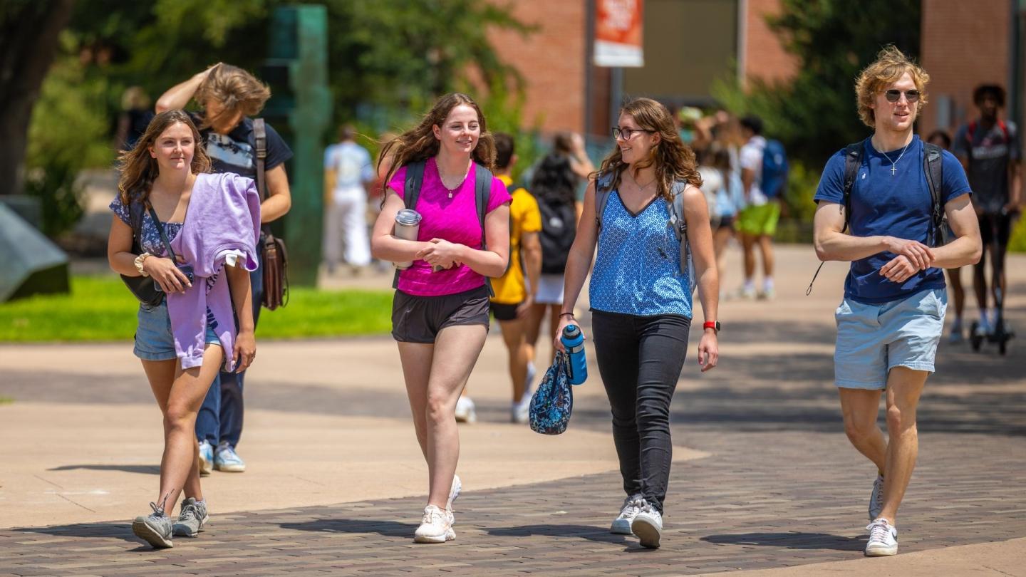 students walk on campus on the first day of school Fall 2023